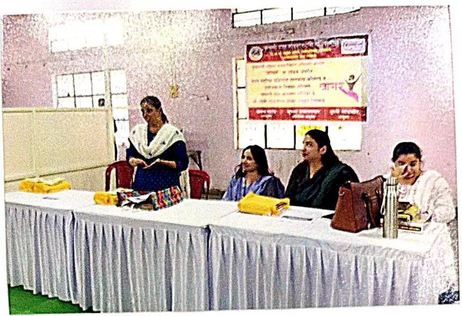 Speakers seated at a table during the Parbhani workshop